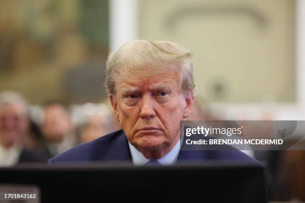 Former US President Donald Trump attends the trial of himself, his adult sons, the Trump Organization and others in a civil fraud case brought by...