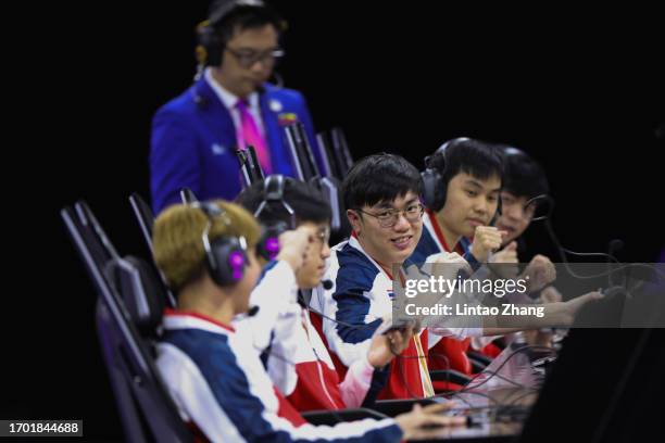 Kawee Wachiraphas of Team of Thailand celebrate with teammate after win the Arena of Valor Asian Games Version Bronze Medal Match against team Viet...