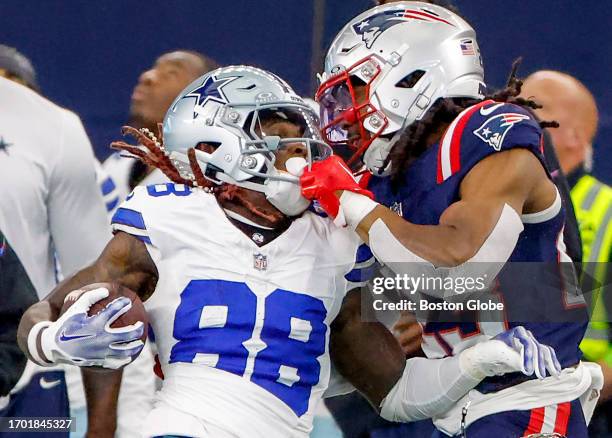 Arlington, TX New England Patriots S Kyle Dugger grabs the facemask of Dallas Cowboys WR CeeDee Lamb in the first quarter. The Patriots lost to the...