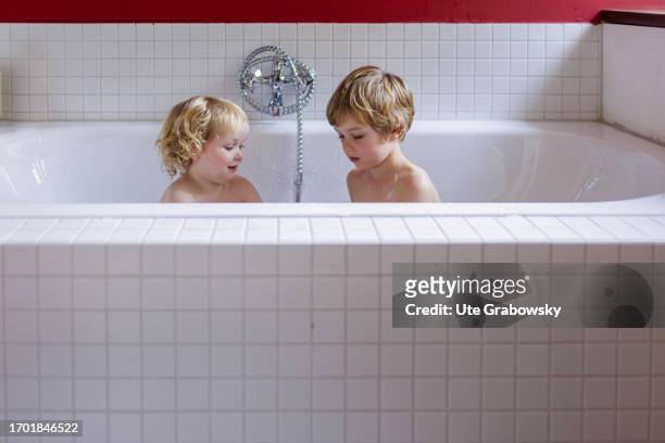 In this photo illustration children taking a bath on September 30, 2023 in Bonn, Germany.