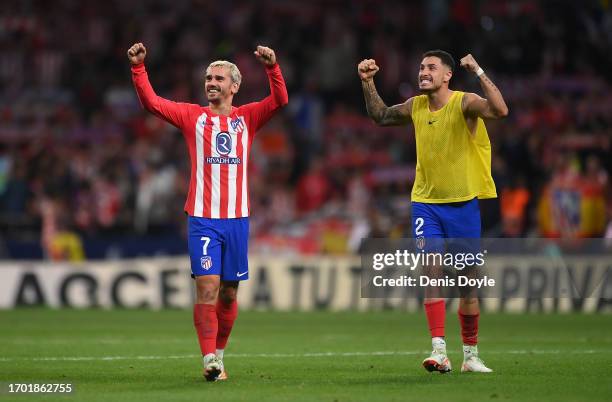 Antoine Griezmann of Atletico de Madrid celebrates with teammate Jose Maria Gimenez after the team's victory during the LaLiga EA Sports match...