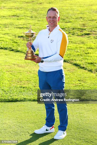 Luke Donald, Captain of Team Europe poses with the Ryder Cup trophy during the European Team Portraits at the 2023 Ryder Cup at Marco Simone Golf...