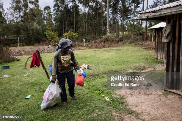 Porter and Chef Joseph Kimani arrives home with his cooking equipment in Gitinga Village, where 60% of the men work as mountain porters accounting to...