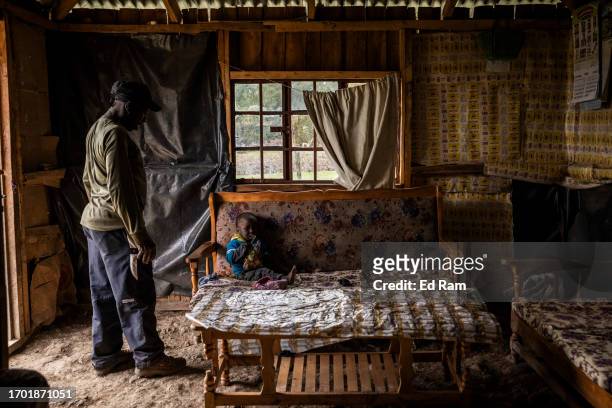 Porter and Chef Joseph Kimani, arrives home and greets his son Fredrick in Gitinga Village, where 60% of the men work as mountain porters accounting...