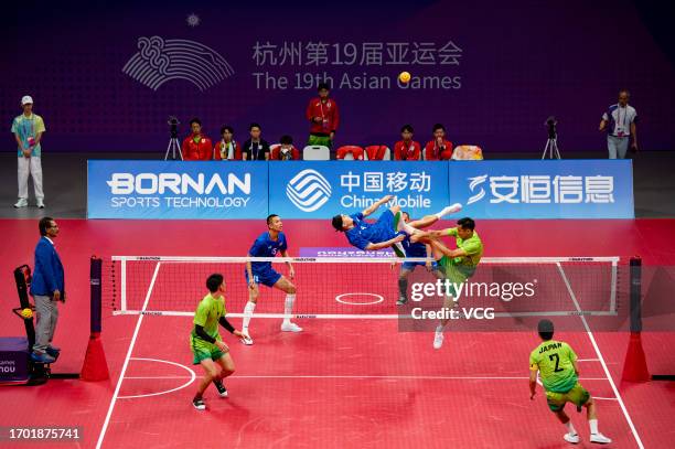 Toshitaka Naito of Team Japan competes against Thawisak Thongsai of Team Thailand in the Sepaktakraw - Men's Team Regu Preliminary Group A on day...