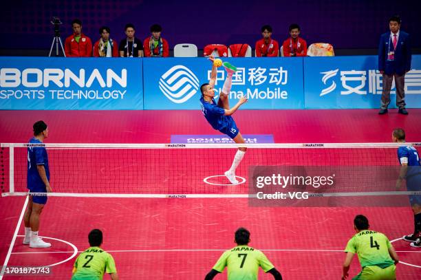 Pornthep Tinbangbon of Team Thailand competes against Team Japan in the Sepaktakraw - Men's Team Regu Preliminary Group A on day three of the 19th...