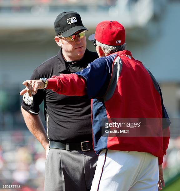 Washington Nationals manager Davey Johnson argues a call with umpire Chris Conroy at first base after Minnesota Twins center fielder Aaron Hicks was...