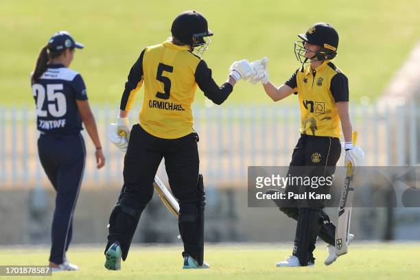 Chloe Piparo of Western Australia celebrates her half century with Mathilda Carmichael during the WNCL match between Western Australia and Victoria...