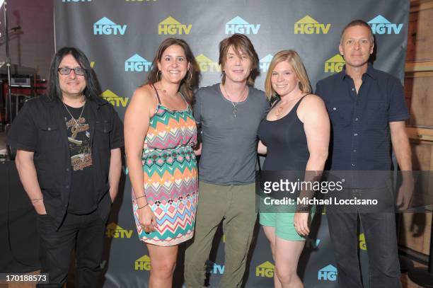 Robby Takac, John Rzeznik and Mike Malinin of the Goo Goo Dolls pose with fans during HGTV'S The Lodge At CMA Music Fest - Day 3 on June 8, 2013 in...