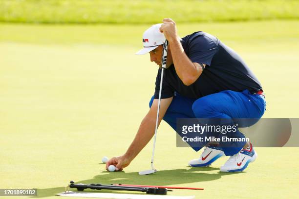 Scottie Scheffler of Team United States lines up a putt in the practice area prior to the 2023 Ryder Cup at Marco Simone Golf Club on September 25,...