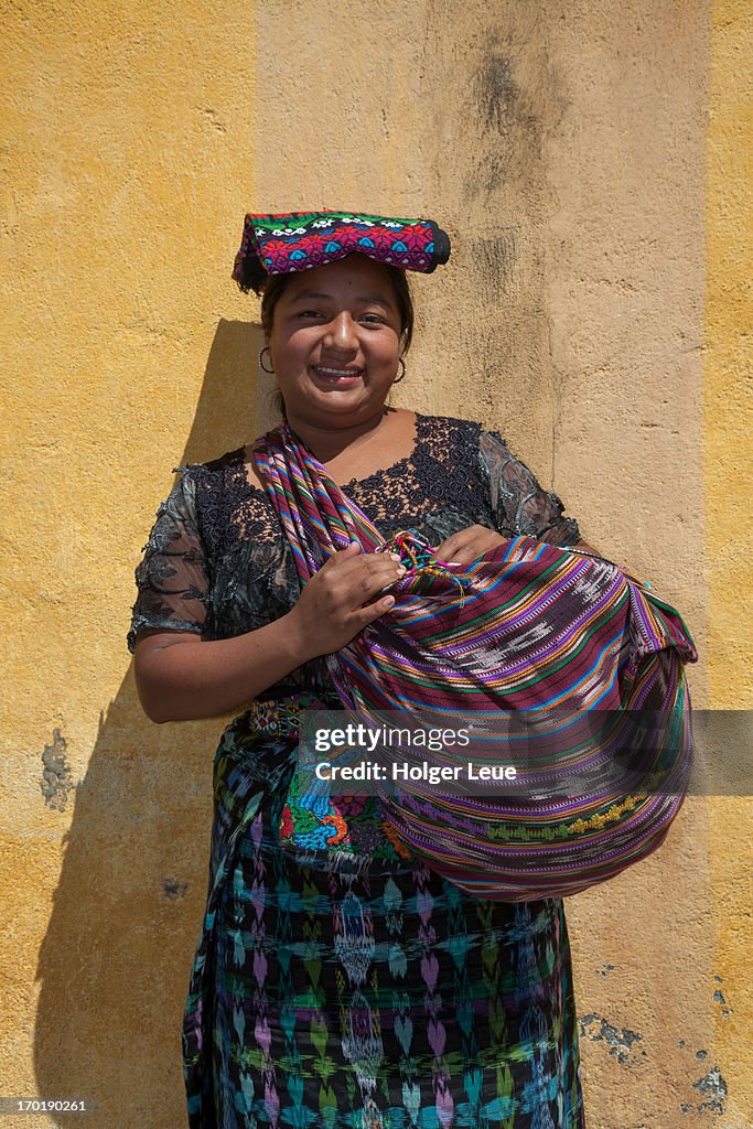 Young woman sells traditional handicrafts