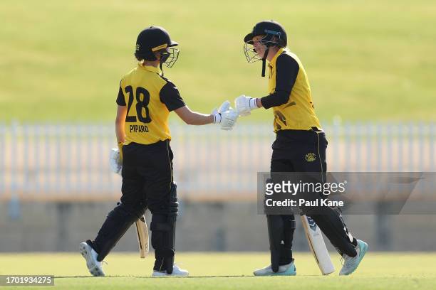 Chloe Piparo and Mathilda Carmichael of Western Australia fist bump during the WNCL match between Western Australia and Victoria at the WACA, on...