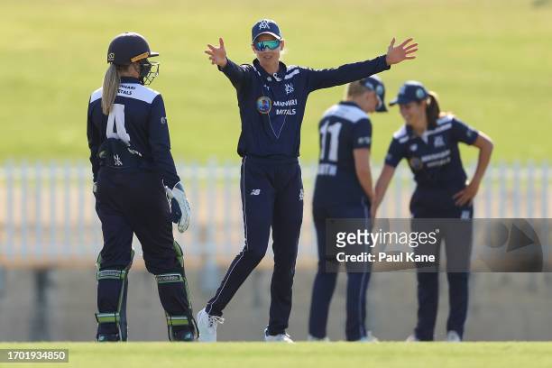 Meg Lanning of Victoria talks with Nicole Faltum oduring the WNCL match between Western Australia and Victoria at the WACA, on September 26 in Perth,...