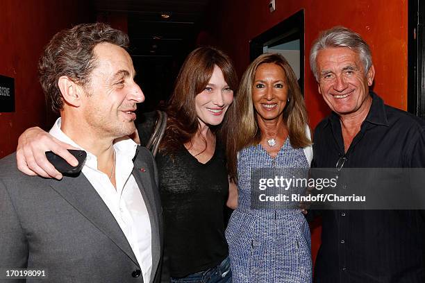 Former french President Nicolas Sarkozy with his wife singer Carla Bruni and producer Gilbert Coullier with his wife Nicole backstage at Michel...
