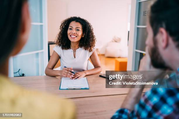 group of business persons talking in the office. - interview-clipboard stock pictures, royalty-free photos & images