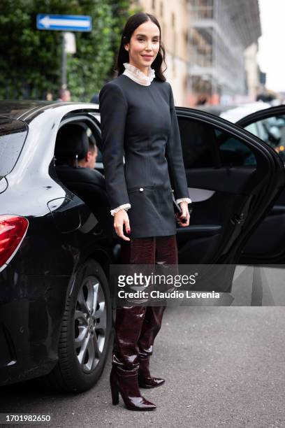 Paola Di Benedetto, wearing a blue dress and bordeaux leather high boots, is seen outside Philosophy by Lorenzo Serafini, during the Milan Fashion...