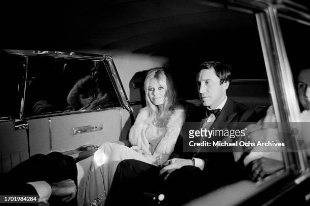 French actress Brigitte Bardot and her boyfriend, Brazilian film producer Bob Zagury, arrive for the Hollywood premiere of 'Viva Maria!', at the...