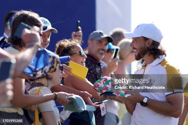 Tommy Fleetwood of Team Europe signs autographs for fans during a practice round prior to the 2023 Ryder Cup at Marco Simone Golf Club on September...