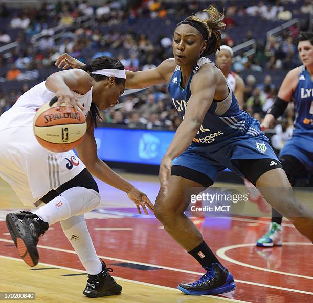 Washington Mystics guard Ivory Latta , left, attempts to drive against Minnesota Lynx guard Monica Wright in the fourth quarter at the Verizon Center...