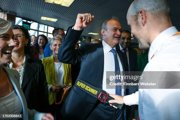 Sir Ed Davey, leader of the Liberal Democrats, arrives in the conference centre and is security checked at Bournemouth International Centre on...