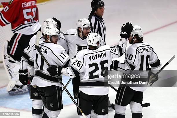 Anze Kopitar, Jeff Carter, Drew Doughty, Slava Voynov and Mike Richards of the Los Angeles Kings celebrate after Kopitar scored a goal in the third...