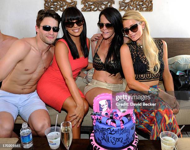 Nate Maaske, Cheryl Burke, Allison Melnick and Paris Hilton attend Melnick's birthday celebration at Daylight Beach Club at the Mandalay Bay Resort &...