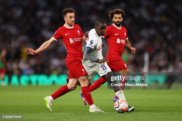Diogo Jota of Liverpool in action with Yves Bissouma of Tottenham Hotspur during the Premier League match between Tottenham Hotspur and Liverpool FC...