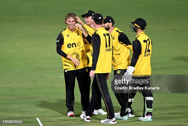 Cooper Connolly of Western Australia is congratulated by team mates after taking the wicket of Henry Hunt of South Australia during the Marsh One Day...