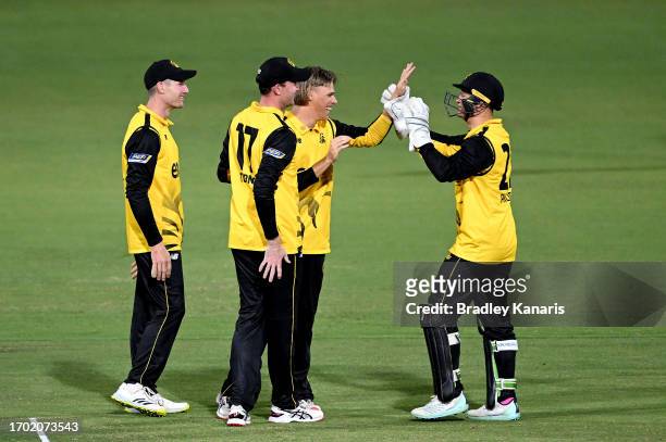 Cooper Connolly of Western Australia is congratulated by team mates after taking the wicket of Henry Hunt of South Australia during the Marsh One Day...