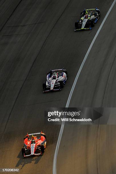 Viso of Venezuela, driver of the Team Venezuela PDVSA/Andretti Autosport Chevrolet, races Helio Castroneves of Brazil, driver of the AAA Insurance...