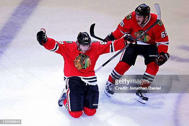 Patrick Kane and Andrew Shaw of the Chicago Blackhawks celebrate after Kane scored the game-winning goal in the second overtime period against the...
