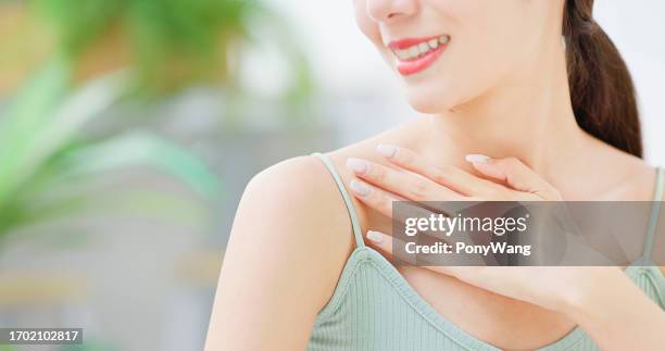 asian woman touch collarbone - clavicle stock pictures, royalty-free photos & images