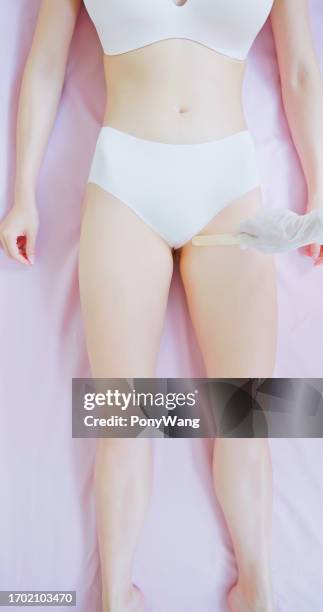 bikini line laser hair removal - pubic hair stock pictures, royalty-free photos & images