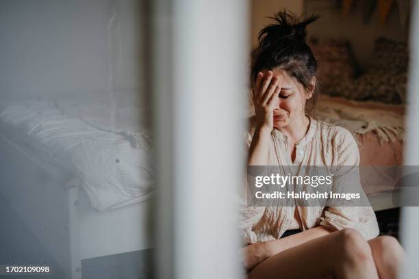 portrait of a sad crying woman. mental health, depression, and sorrow experienced by women. - stemmingswisseling stockfoto's en -beelden