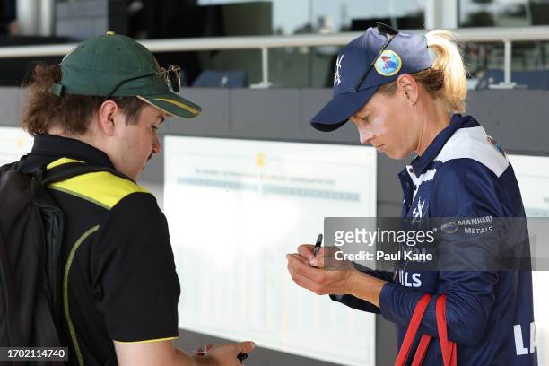 Meg Lanning of Victoria signs autographs following the WNCL match between Western Australia and Victoria at the WACA, on September 26 in Perth,...
