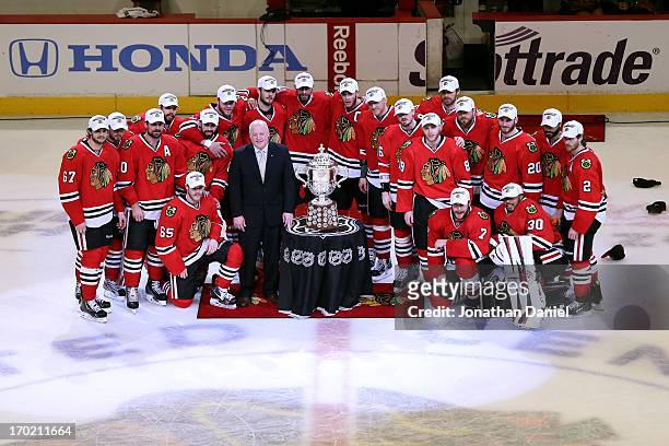 The Chicago Blackhawks pose for a team photo with the Clarence S. Campbell Bowl after they won 4-3 in the second overtime against the Los Angeles...