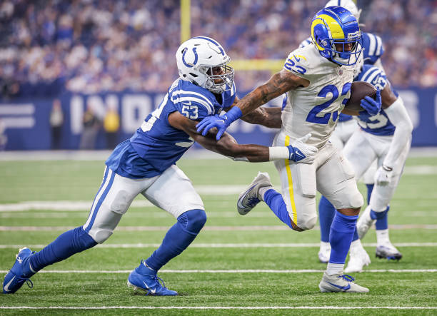 Kyren Williams of the Los Angeles Rams runs the ball against Shaquille Leonard of the Indianapolis Colts at Lucas Oil Stadium on October 1, 2023 in...