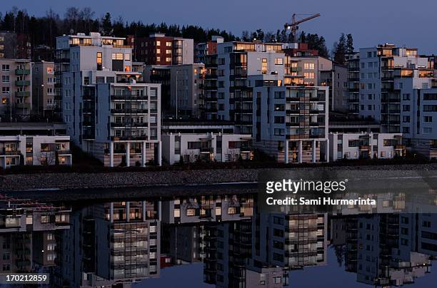 apartment buildings lit by the setting sun - jyväskylä stock-fotos und bilder