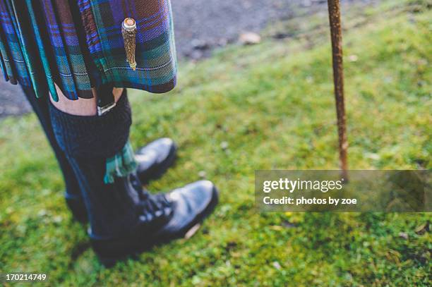 kilts and walking sticks - schottenrock stock-fotos und bilder