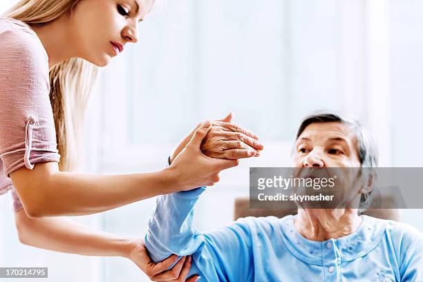 senior woman having physical therapy. - arthritic hands stock pictures, royalty-free photos & images
