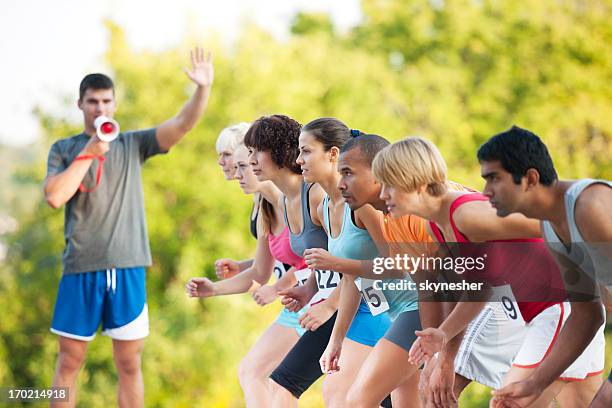 marathon runners at the starting line. - marathon start stock pictures, royalty-free photos & images