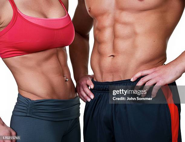 muscular man and woman - six pack stock pictures, royalty-free photos & images