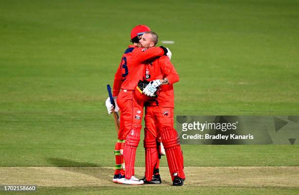 Daniel Drew of South Australia celebrates with team mate Jake Lehmann after scoring a century during the Marsh One Day Cup match between South...