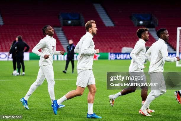 Bayern Munich's French forward Mathys Tel and Bayern Munich's English forward Harry Kane attend a training session of German football club FC Bayern...