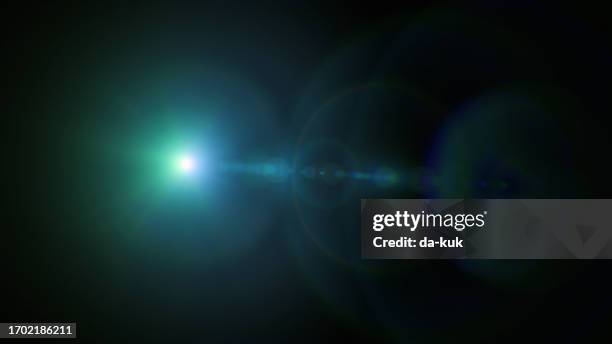 blue lens flare overlay on black background design element - light beam stock pictures, royalty-free photos & images