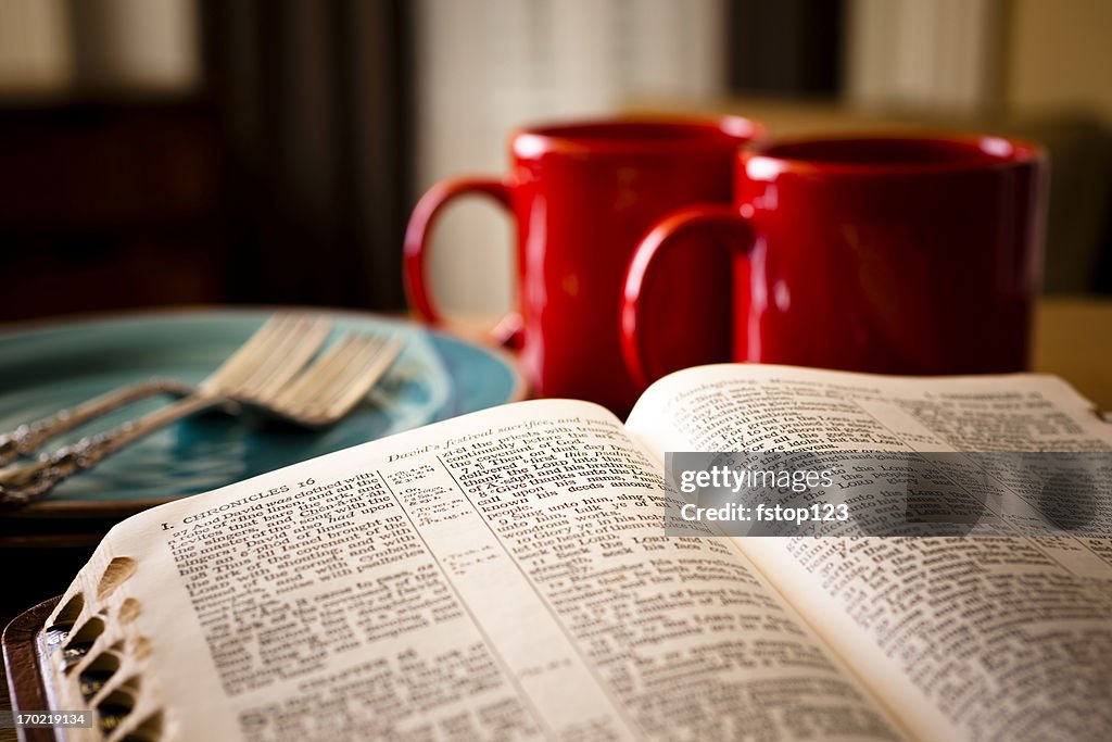 Bible and coffee set for two with red mugs plates
