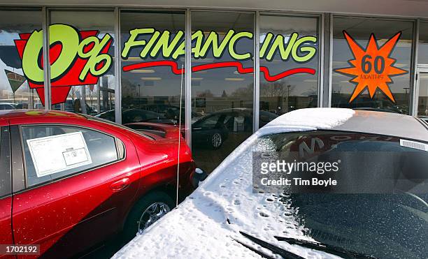 Zero-Percent Financing For 60 Months" signage is displayed on a window at the Dodge World automobile dealership December 27, 2002 in Des Plaines,...