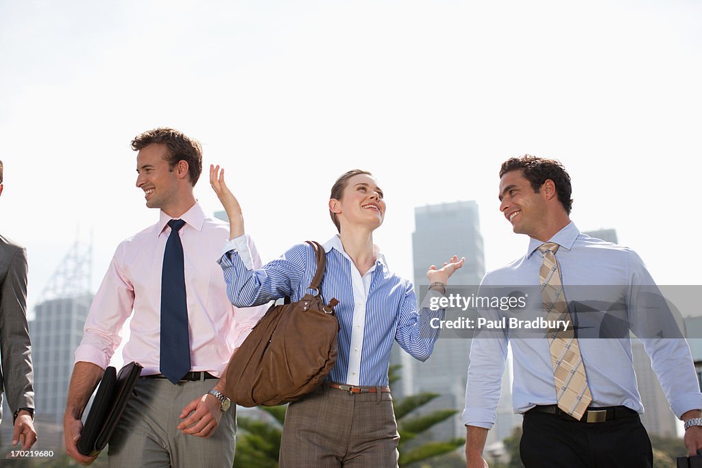 Business people walking together outdoors