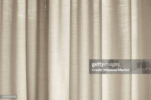 window with drapes covering it - gordijn stockfoto's en -beelden