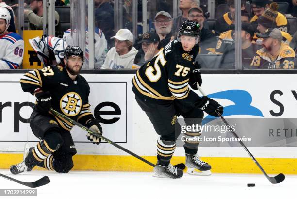 Boston Bruins defenseman Alec Regula looks up ice during a game between the Boston Bruins and the New York Rangers on September 24 at TD Garden in...